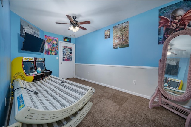 bedroom featuring carpet, baseboards, and a ceiling fan