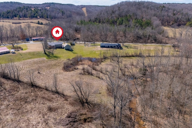 birds eye view of property with a rural view and a forest view