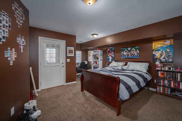 bedroom with baseboards and carpet flooring