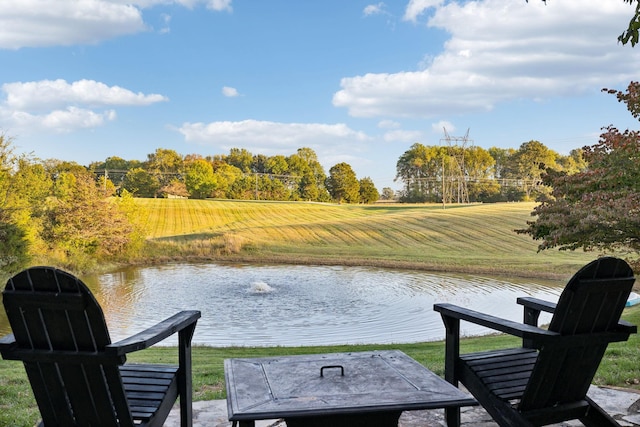 dock area with a yard and a water view