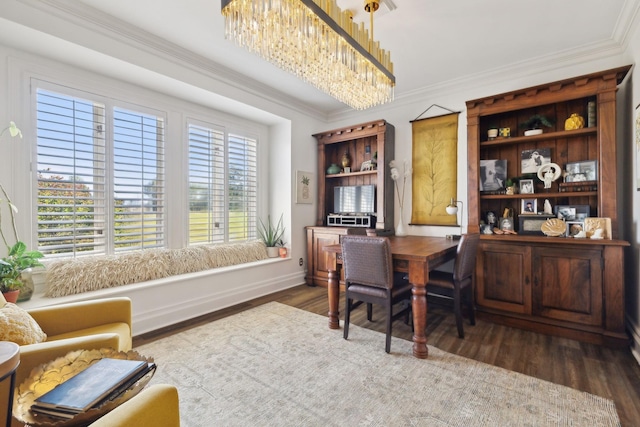 office space with a notable chandelier, baseboards, ornamental molding, and wood finished floors