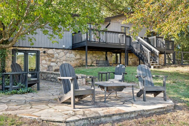 view of patio / terrace with stairs and a wooden deck