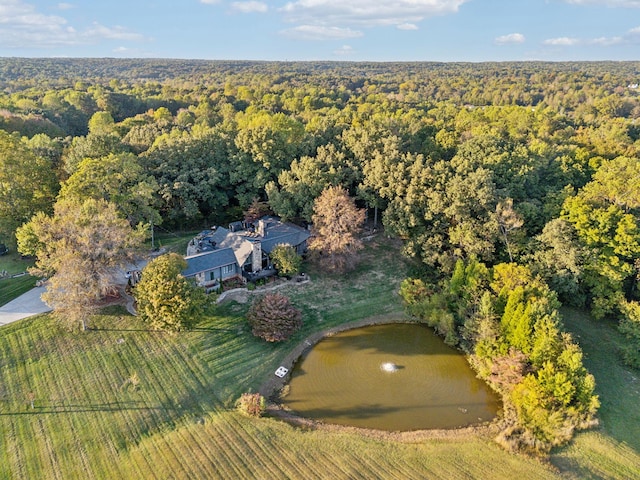 aerial view featuring a wooded view