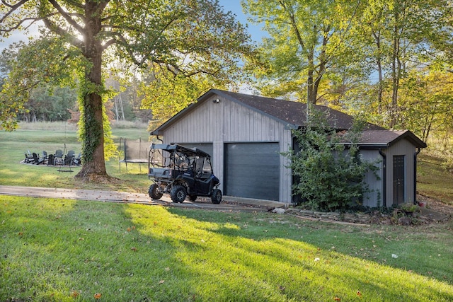 detached garage featuring a trampoline