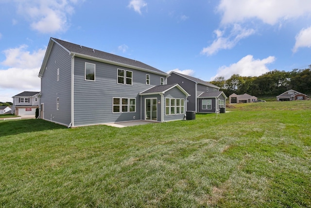 back of house with a yard, a patio, and central air condition unit