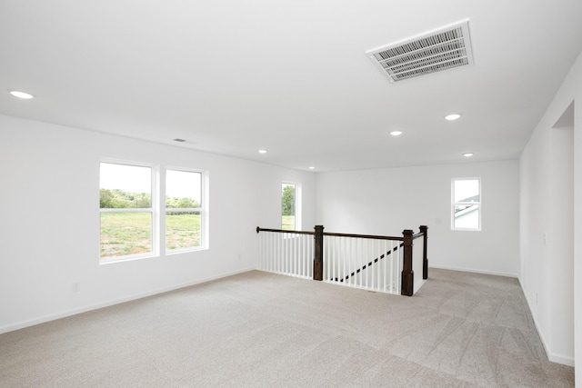 spare room with plenty of natural light, visible vents, and recessed lighting