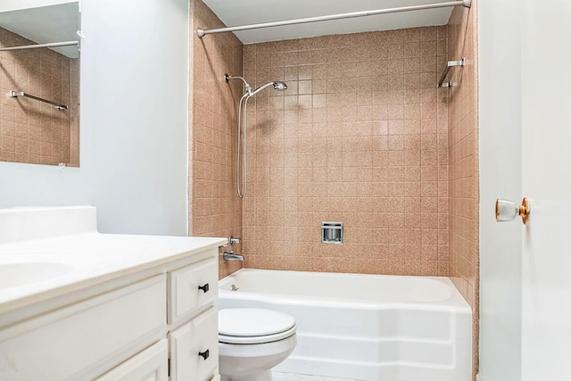 bathroom with toilet, bathtub / shower combination, and vanity