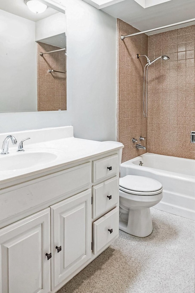 bathroom with toilet, shower / washtub combination, and vanity