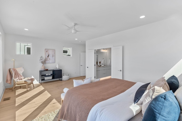 bedroom with light wood-type flooring, visible vents, baseboards, and recessed lighting