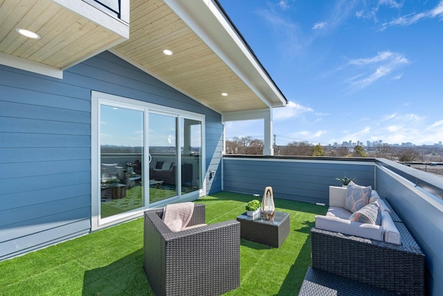 balcony with a city view and an outdoor living space