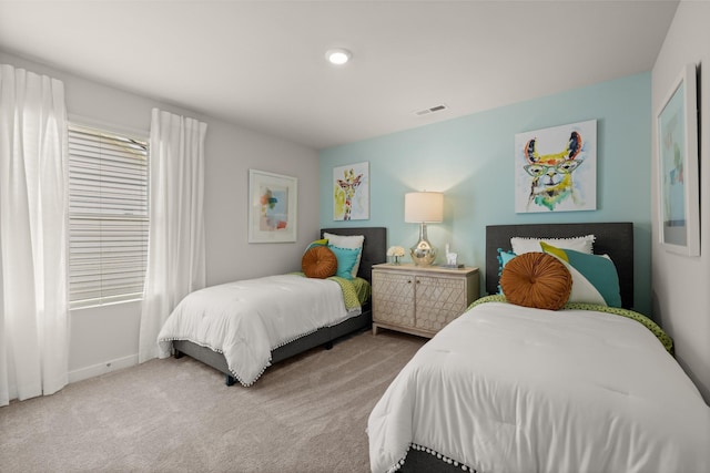 bedroom featuring carpet floors and visible vents