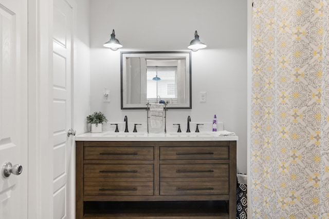 bathroom with double vanity and a sink