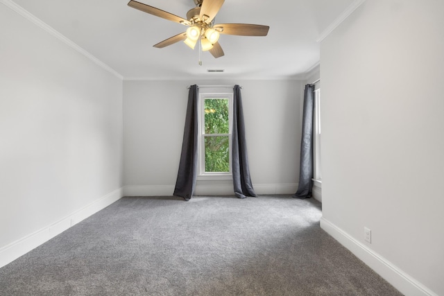 spare room featuring ceiling fan, carpet floors, ornamental molding, and baseboards