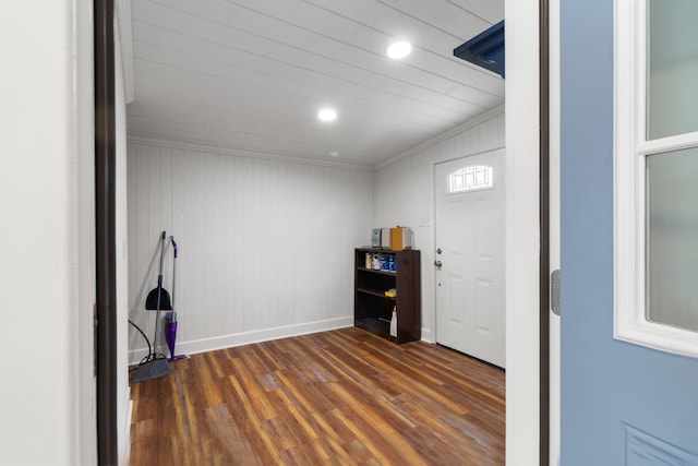 interior space featuring recessed lighting, crown molding, baseboards, and wood finished floors