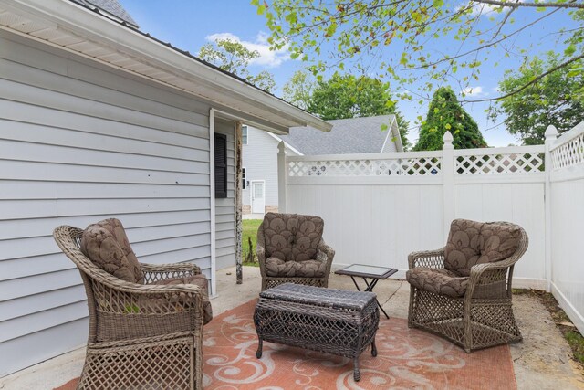 view of patio with fence and an outdoor hangout area