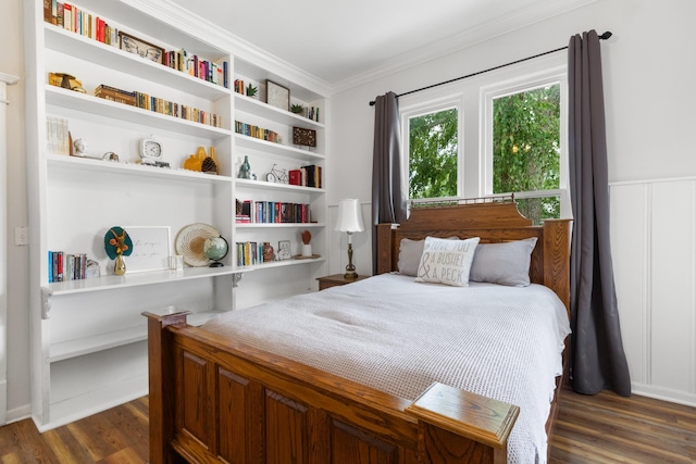 bedroom featuring crown molding and dark wood-style flooring