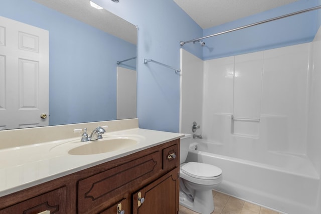 full bathroom with shower / bath combination, toilet, tile patterned floors, a textured ceiling, and vanity