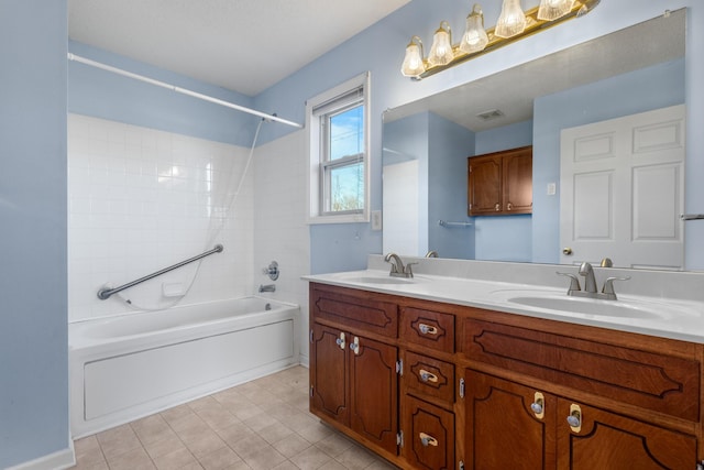 full bathroom with double vanity, visible vents, shower / washtub combination, and a sink