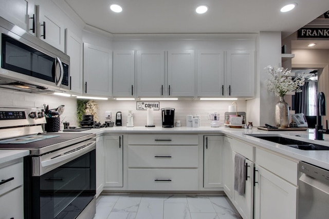 kitchen with tasteful backsplash, appliances with stainless steel finishes, and recessed lighting