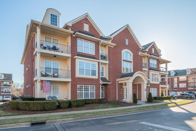 townhome / multi-family property with brick siding