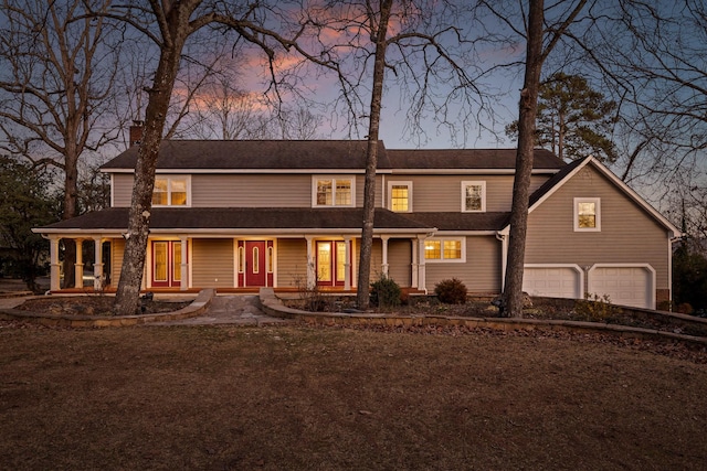 view of front of home featuring a garage and a chimney