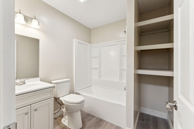 306 W 17th St, Columbia, TN 38401 - bathroom featuring shower / washtub combination, vanity, toilet, and wood finished floors