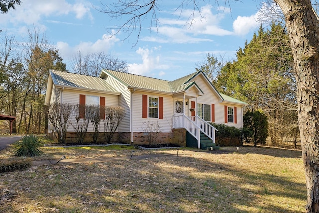 ranch-style house with crawl space, metal roof, and a front yard