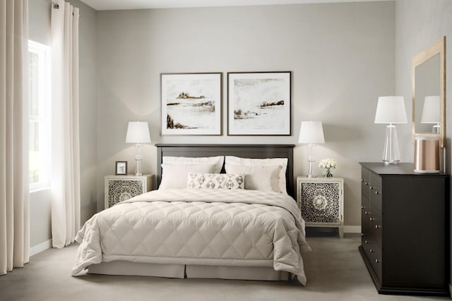 bedroom featuring carpet flooring and baseboards