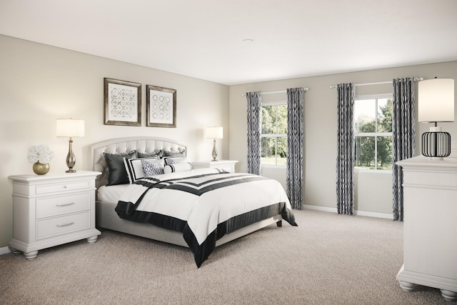 bedroom with light carpet and baseboards