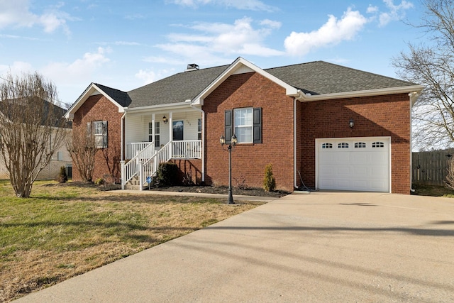 ranch-style house featuring a porch, brick siding, an attached garage, and a front lawn