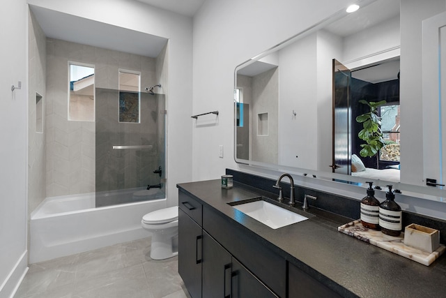 full bathroom with shower / bath combination, vanity, and toilet