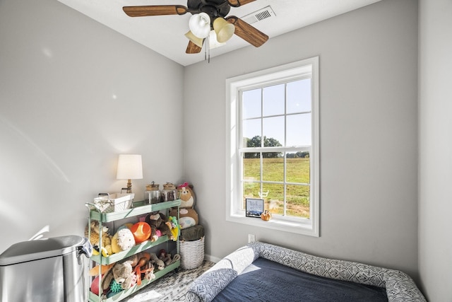 bedroom featuring ceiling fan and visible vents