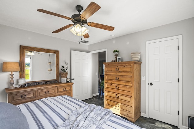 bedroom featuring a ceiling fan, visible vents, and baseboards