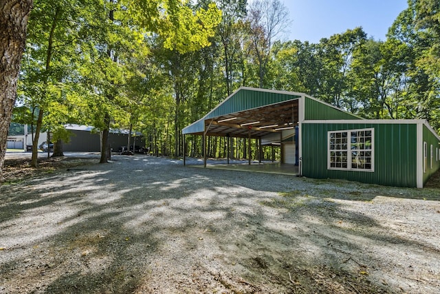 view of community featuring an outbuilding, an outdoor structure, and a detached garage