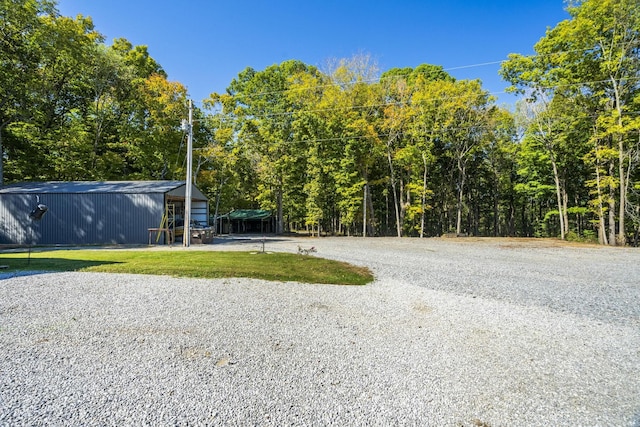 view of community with an outbuilding