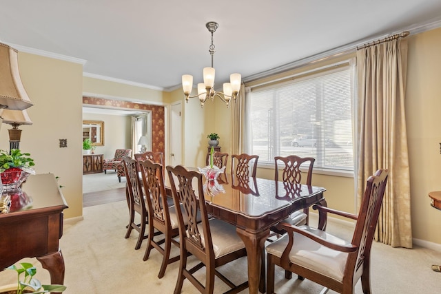 dining area with light carpet, ornamental molding, baseboards, and an inviting chandelier