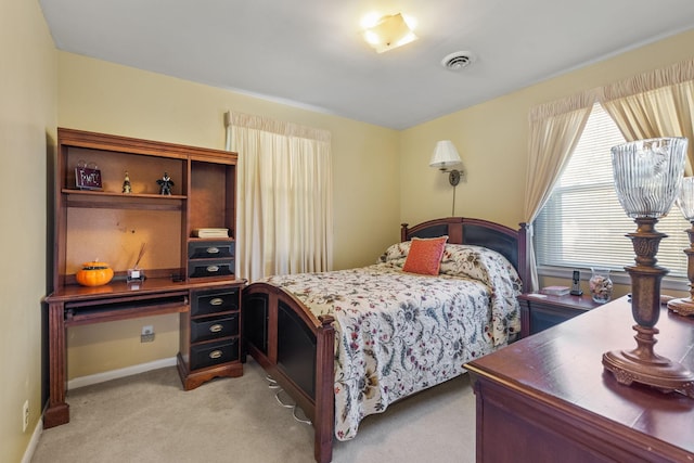 bedroom with light carpet, baseboards, and visible vents