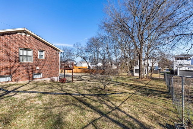 view of yard featuring a deck and fence