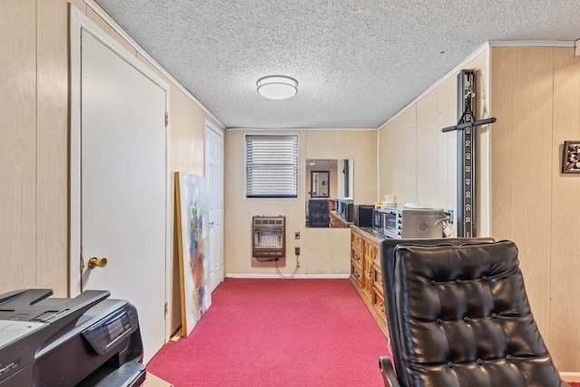 kitchen featuring a textured ceiling, carpet floors, and heating unit