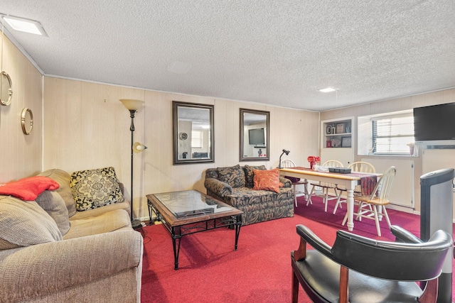 living room featuring carpet flooring and a textured ceiling