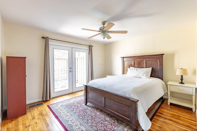 bedroom with access to exterior, french doors, visible vents, light wood-style floors, and baseboards