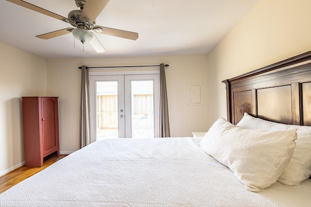 bedroom with wood finished floors, a ceiling fan, baseboards, access to outside, and french doors