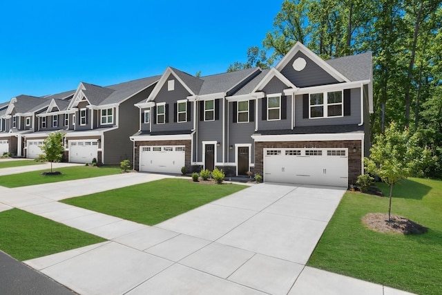 view of front of house featuring a garage, a residential view, concrete driveway, and a front lawn