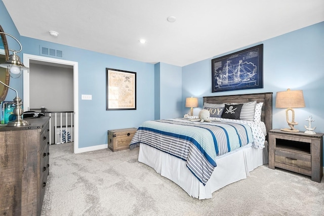 bedroom featuring carpet, visible vents, and baseboards