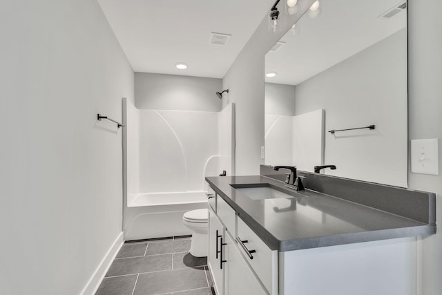 bathroom featuring toilet, vanity, visible vents, tile patterned floors, and washtub / shower combination