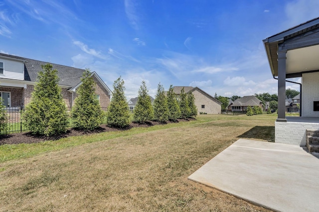 view of yard with a patio and fence