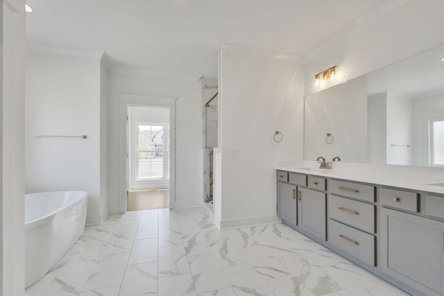 full bath with double vanity, marble finish floor, baseboards, and crown molding