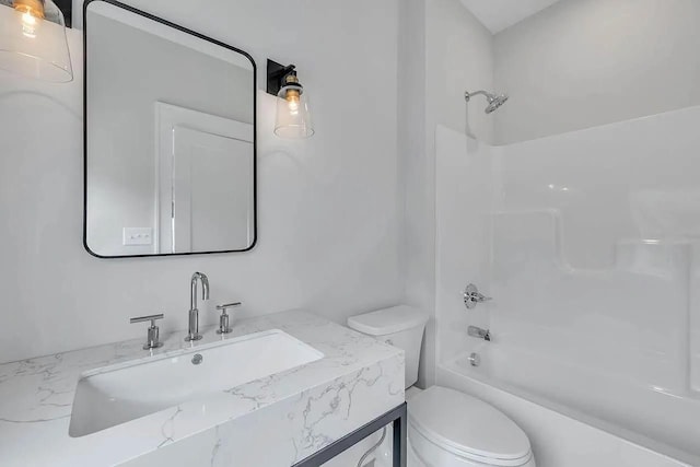 bathroom with shower / bathtub combination, vanity, and toilet