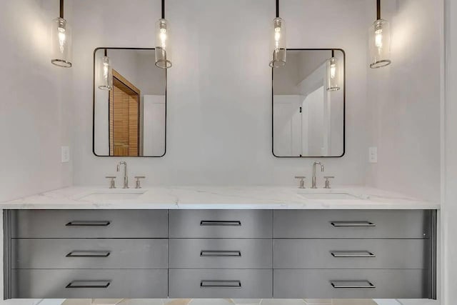 bathroom with double vanity and a sink