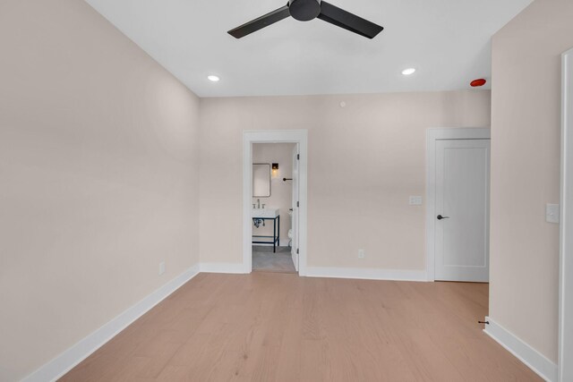 empty room with light wood-style floors, baseboards, a ceiling fan, and recessed lighting